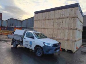 ute with crate n pack solutions logo and timber shipping case in background