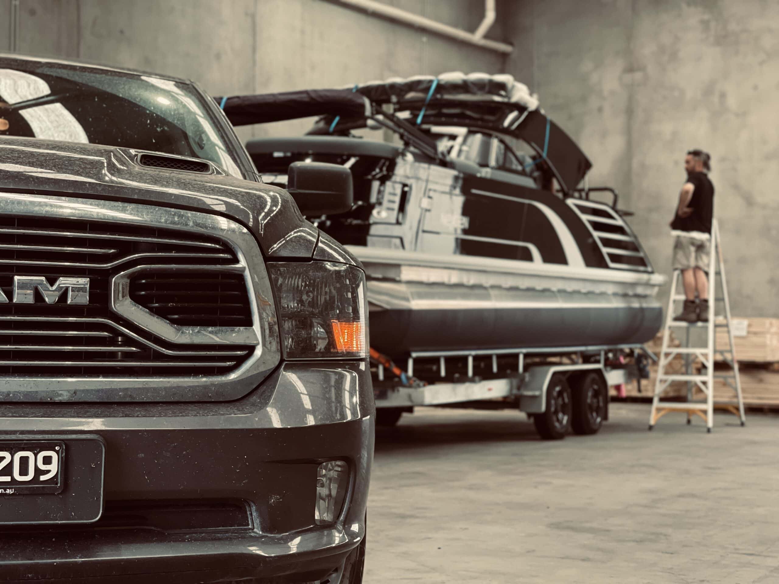 marine boat and Dodge Ram parked in Crate n Pack Factory