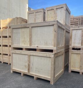 plywood cases and timber cases in background