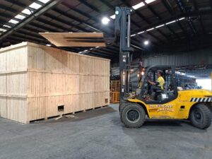 wooden shipping crate and forklift