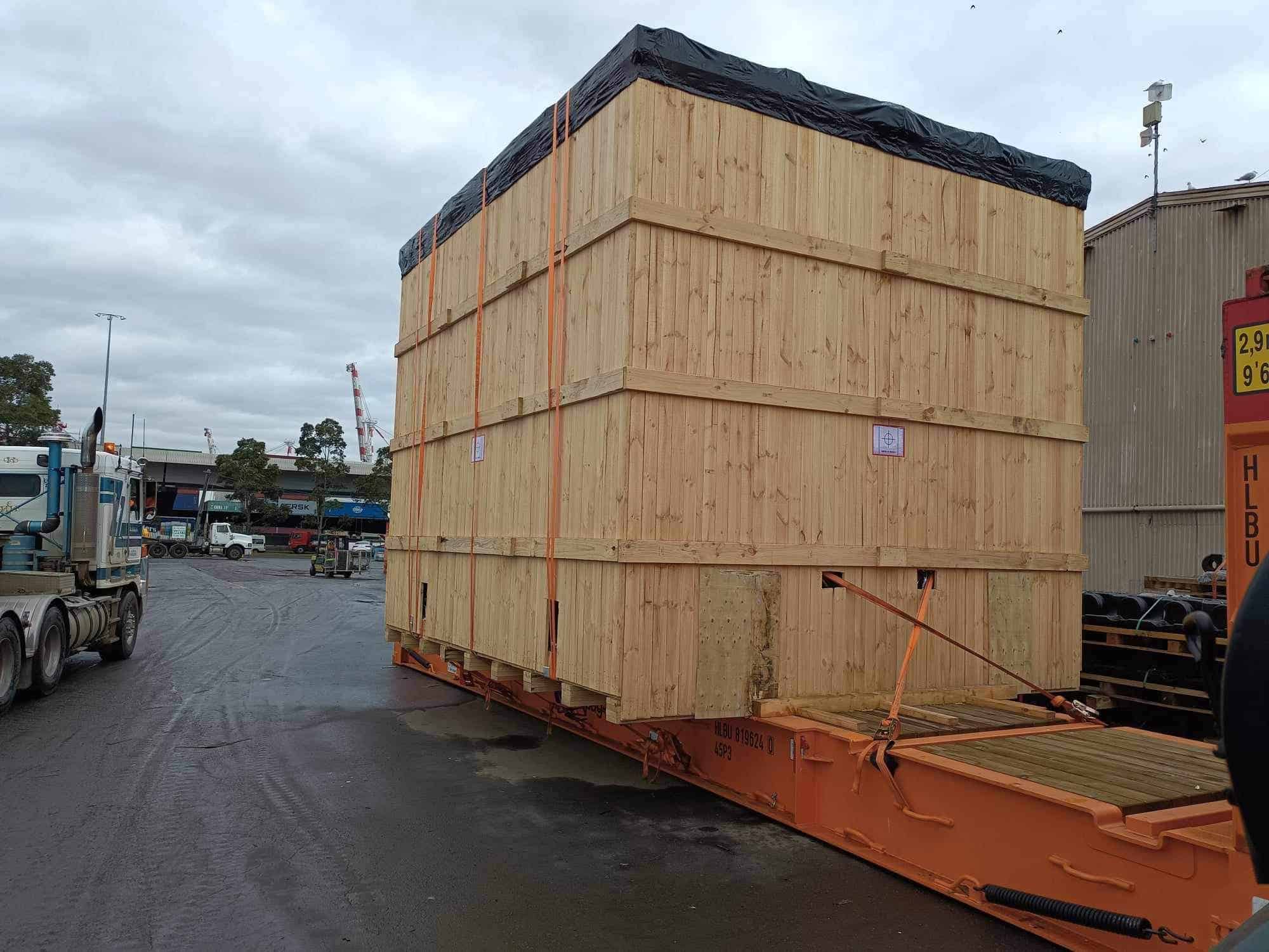 Wooden Shipping Case on a flat racked shipping container