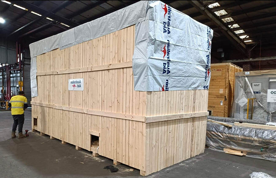 machine packaging solutions in wooden shipping crate