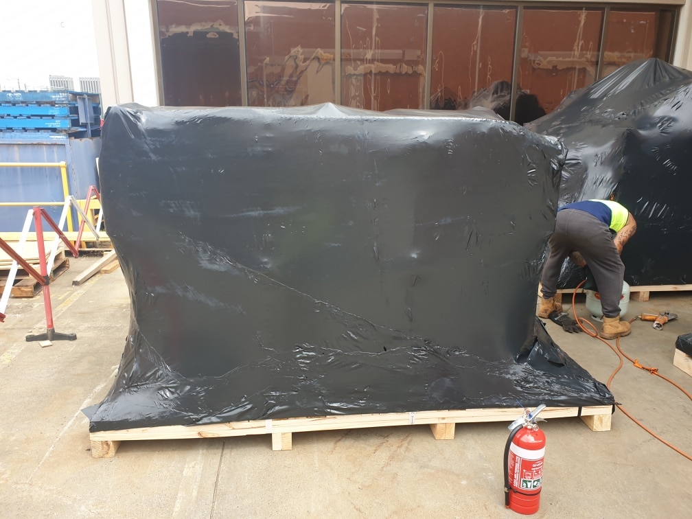 timber base and black shrink wrap