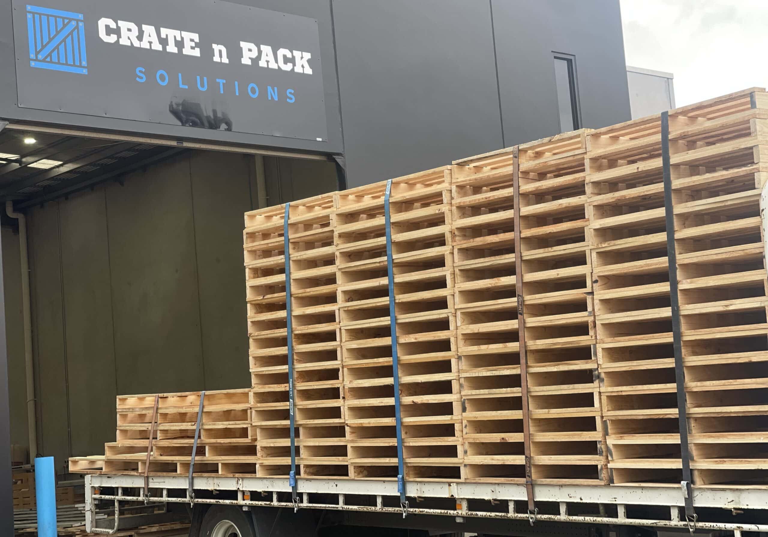 pallets with crate n pack log in background