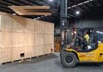 wooden shipping crate and forklift