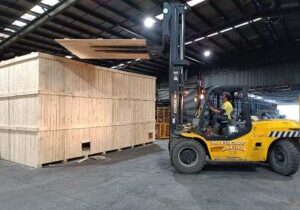 wooden shipping crate and forklift