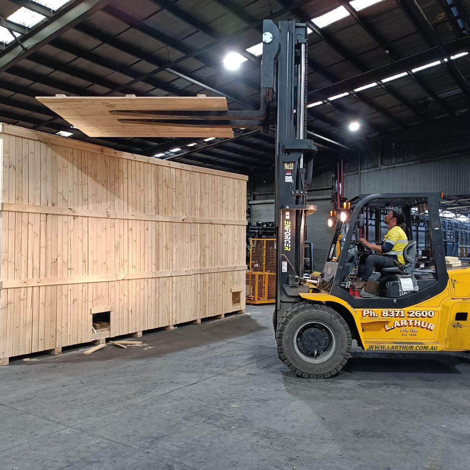 wooden shipping crate and forklift