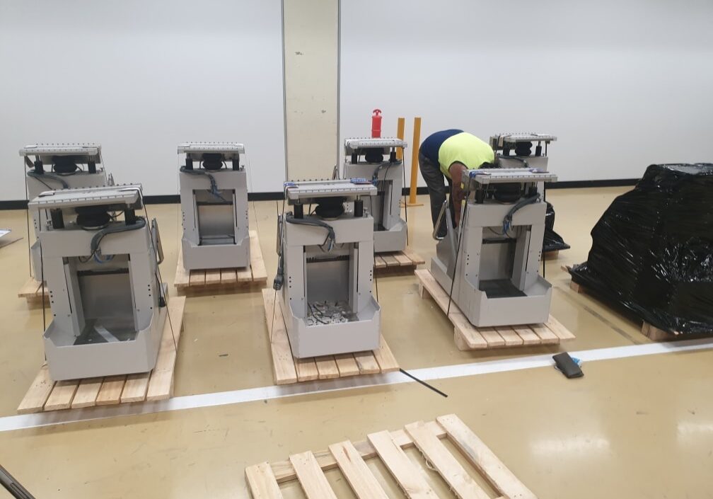 machine crating service with image of crate n pack solutions logo in background