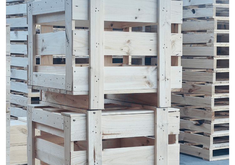 custom wooden crates stacked in Melbourne warehouse with Crate n Pack logo in background