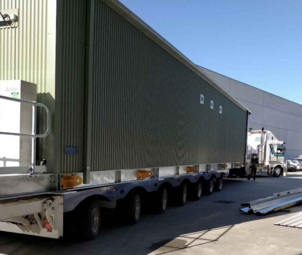 large shipping container on transport truck