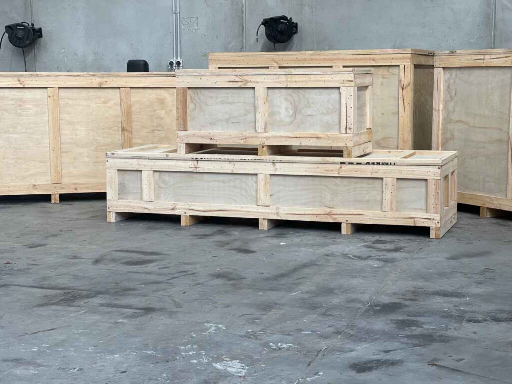 large plywood shipping crates stacked 1