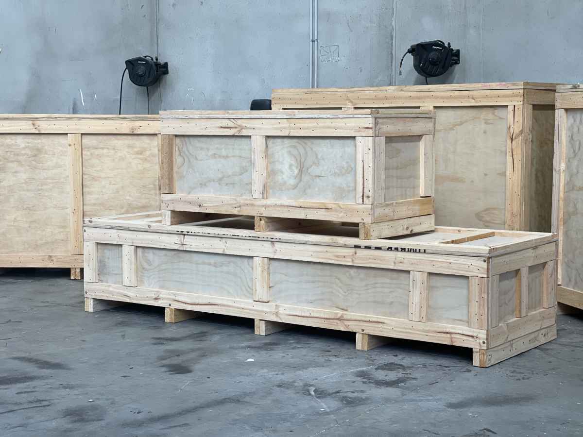 large wooden crates stacked on top of eachother