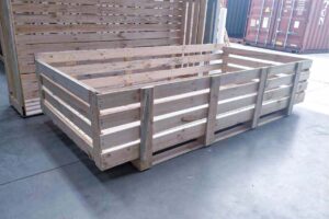 timber shipping crate with shipping container in background