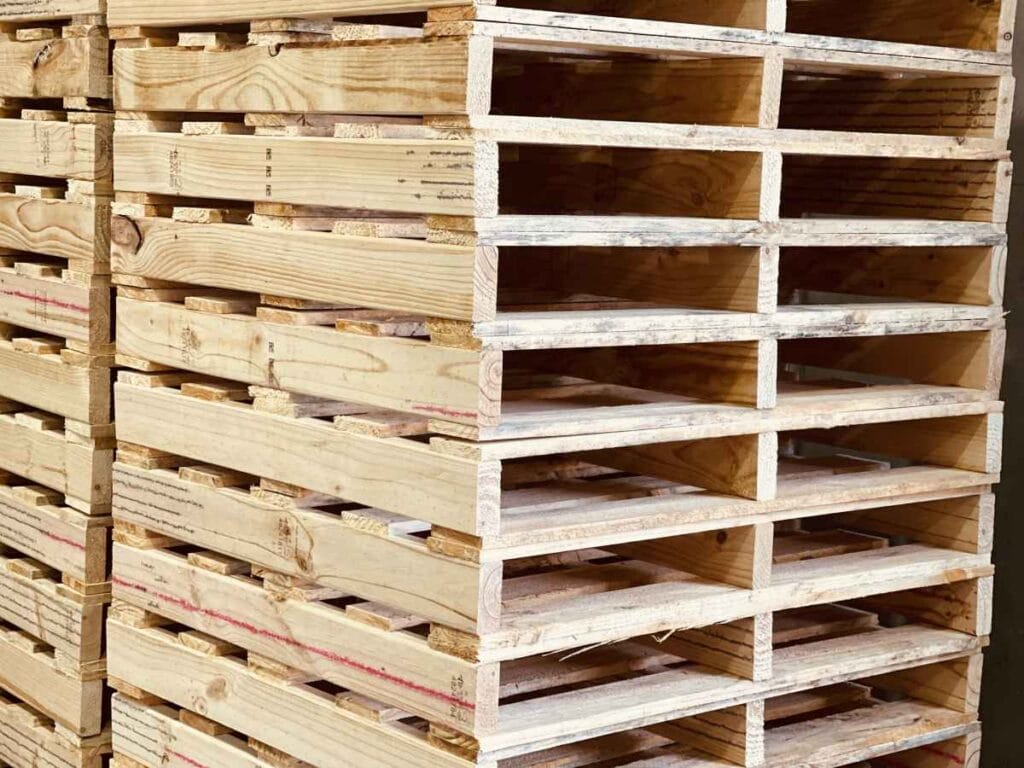 export pallets stacked with plain pallets stacked in background 1